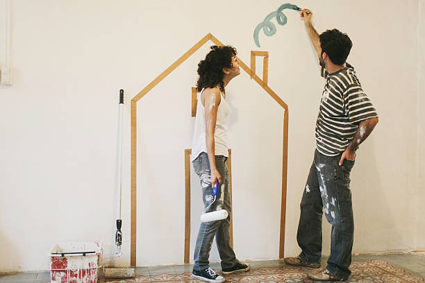 istock Young couple painting their apartment. 538144415