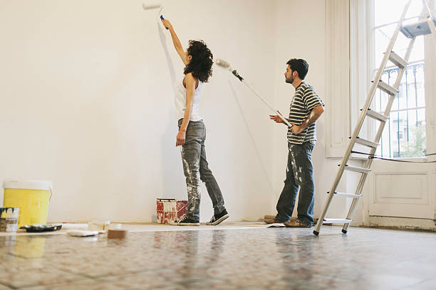istock Young couple painting their apartment. 538144417