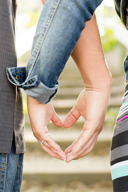 istock Couple makes heart with their hands 538146695