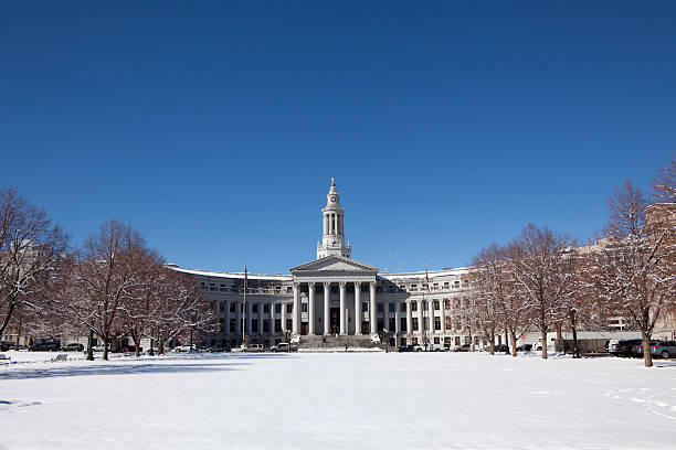 Snowy park and Denver County Building Colorado copy space