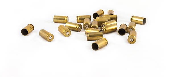 ammunition shell 9 mm. old 9 mm.  ammunition shell on white background bullet cartridge photos stock pictures, royalty-free photos & images