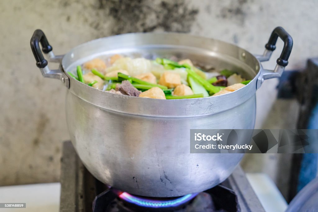 pot on stove cooking in a pot on stove at old kitchen 2015 Stock Photo