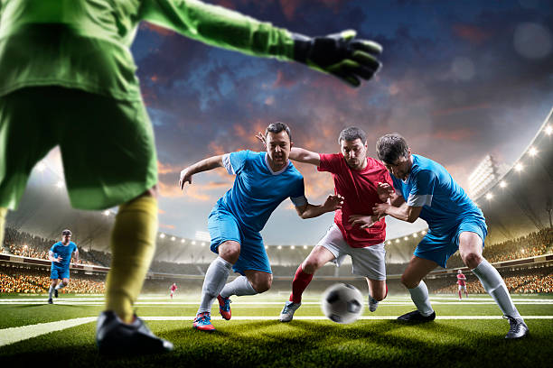 istock Soccer players in action on sunset stadium background panorama 538151342