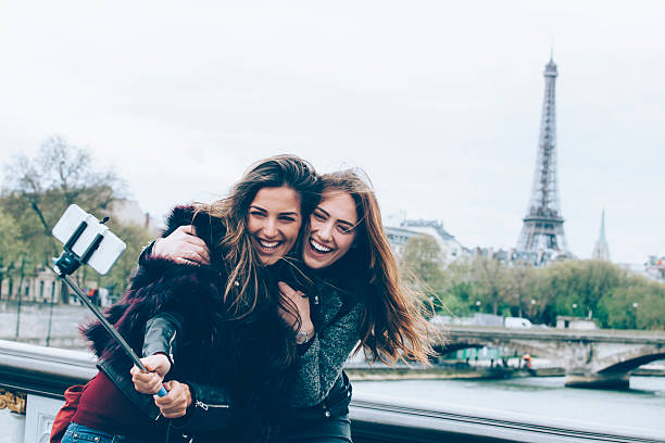 istock Young friends making selfie with monopod on a bridge 538151428