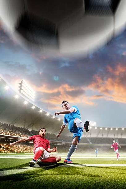 istock Soccer players in action on sunset stadium background 538152950