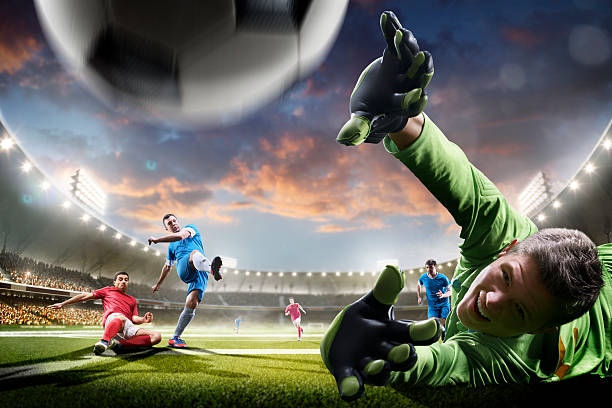 istock Soccer players in action on sunset stadium background panorama 538153228