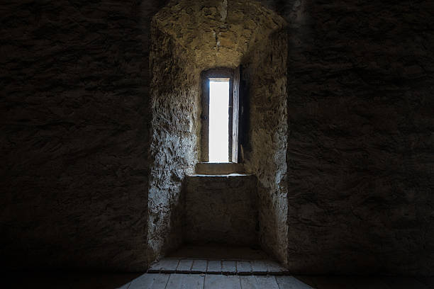 istock Dark room with stone walls and window 538156060
