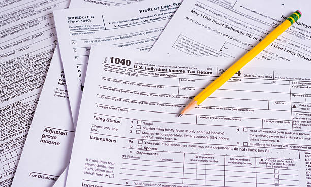 istock United States Tax Forms with a pencil 538156340