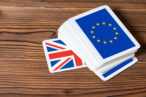 collage on event Brexit UK EU referendum concept of card game shootout, close up