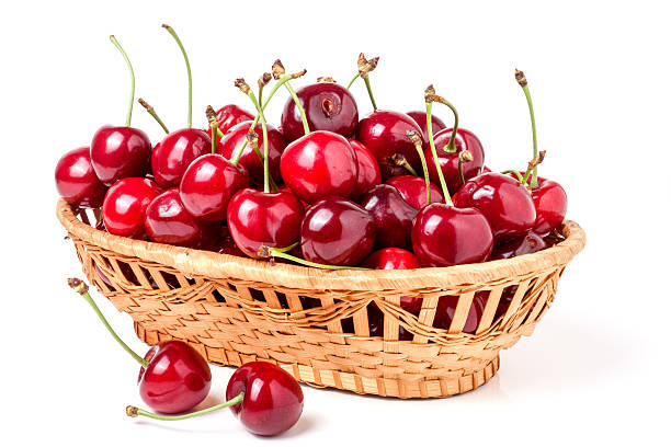 istock cherries in a wicker basket isolated on white background 538159912