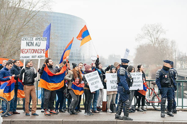 Armenian  diaspora protesting Strasbourg, France - January 28, 2015: Armenian diaspora demonstrates near European Court of HR before the Perincek vs. Switzerland case begin. Armenian government was represented by Amal Clooney european court of human rights stock pictures, royalty-free photos & images