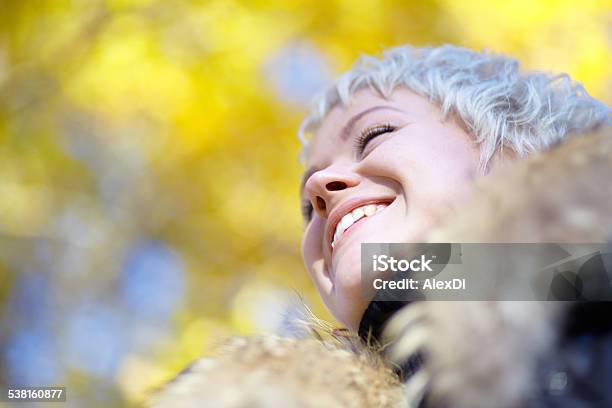 Smiling Blond Looks Into The Distance Stock Photo - Download Image Now - 2015, Adult, Adults Only