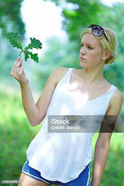 Girl With Oak Leaves In The Hands Stock Photo - Download Image Now - 2015, Adult, Backgrounds