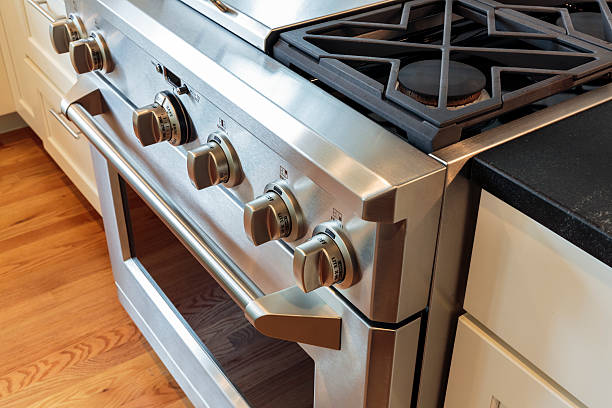 Close up stainless steel stove with oven stock photo