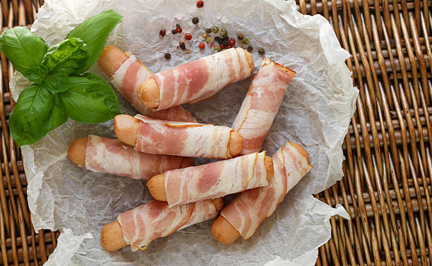 istock Sausages wrapped in bacon ready for roasting 538161216