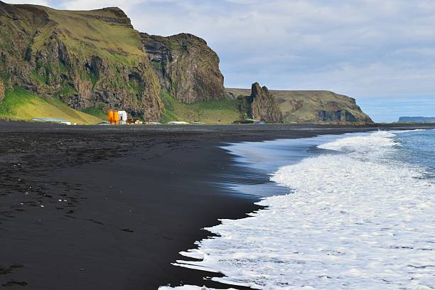 Black sand beach at Vik Black sand beach at Vik, Iceland black sand stock pictures, royalty-free photos & images