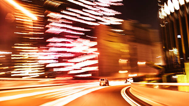 auto motion blur veloci - rush hour flash foto e immagini stock