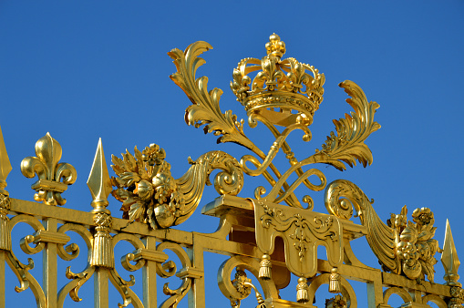 Versailles, France - April 19, 2015: Golden Main Gates of the Versailles Palace.