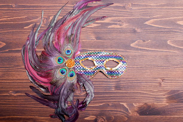 istock beautiful feather mask on brown board 538163167