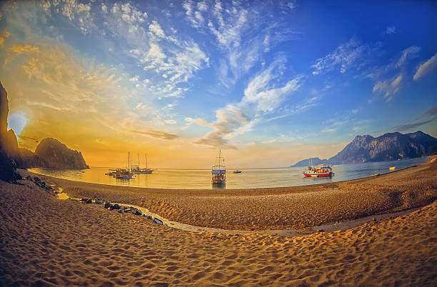Colorful sea beach sunrise. Panoramic Olympos Beach Colorful sea beach sunrise. Panoramic Olympos Beach, Cirali, Turkey cirali stock pictures, royalty-free photos & images