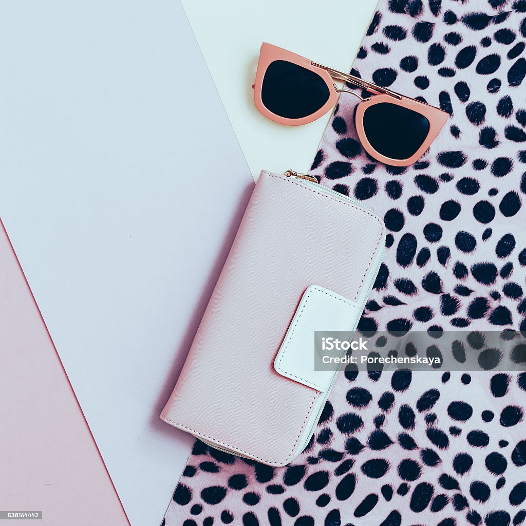 Ladies Fashion Accessories. Pink Clutch and sunglasses. Pastel c Ladies Fashion Accessories. Pink Clutch and sunglasses. Pastel colors Trend Adult Stock Photo