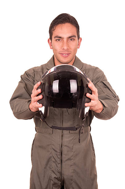 istock young male hispanic pilot holding helmet 538164501
