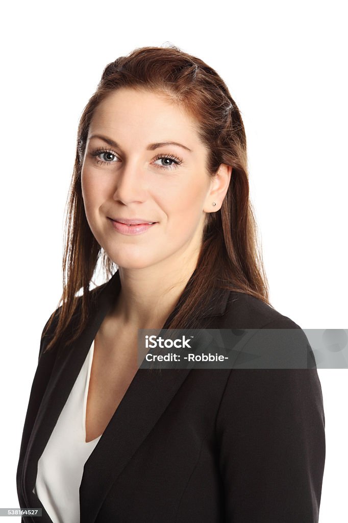 Businesswoman portrait A young attractive businesswoman in her 20s, standing isolated on a white background wearing a black suit and white shirt. White background. Businesswoman Stock Photo