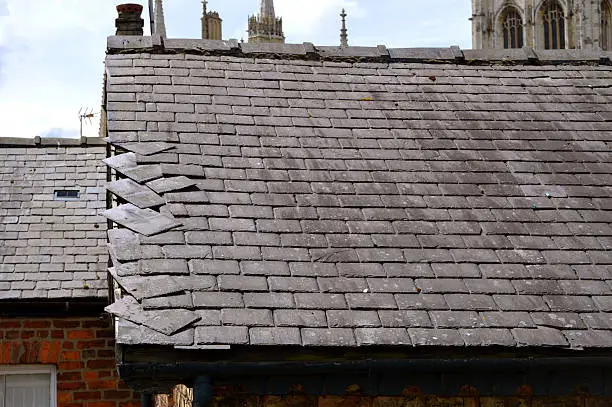 Photo of Loose slates on a house roof