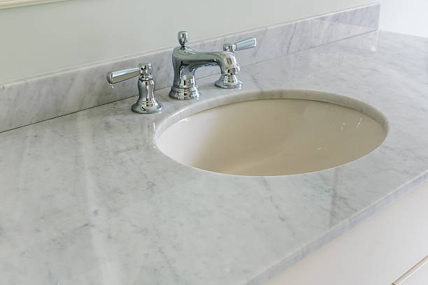Light bathroom with marble counter top stock photo