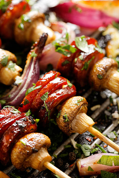 istock Meat and vegetable skewers on a grill pan 538167052