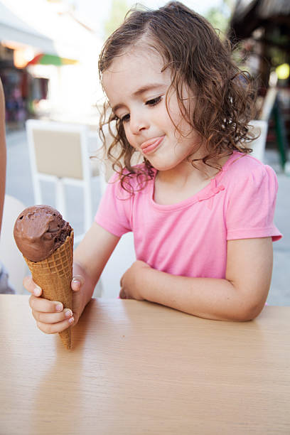 istock girl eating ice cream 538167268