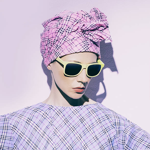 istock Model in checkered scarf and checkered dress. Checkered trend. 538167430