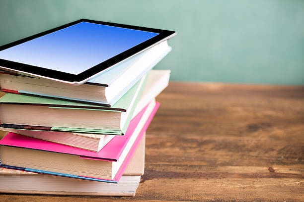 istock Back to school. Education. Textbooks, digital tablet on desk. Chalkboard. 538167672