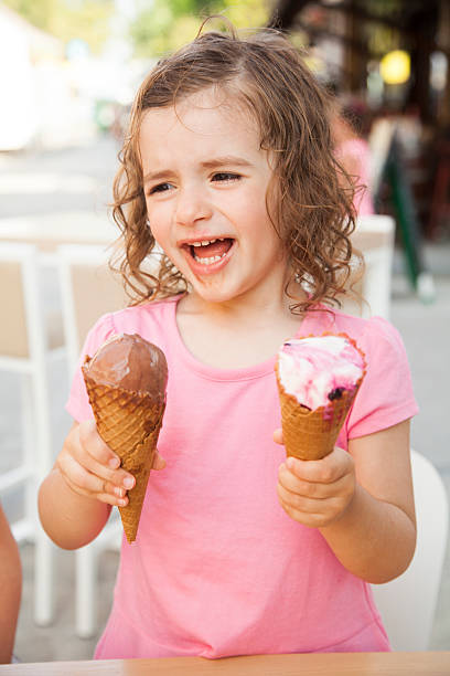istock girl eating ice cream 538168040