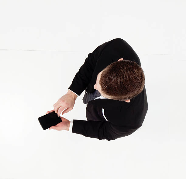 istock Above view of businessman using phone 538168084