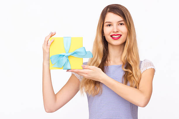 istock Young woman portrait holding gift 538169174