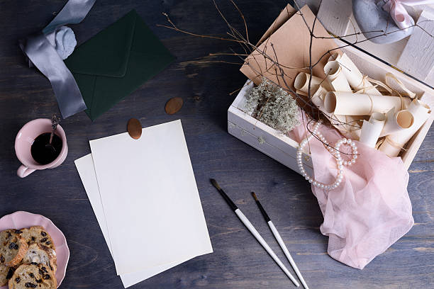 istock Blank invitations and accessories on a wooden office table 538170184