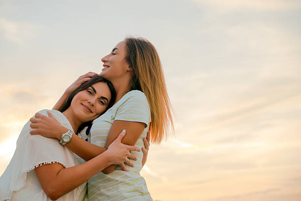 istock girls friends laughing and hug 538173040