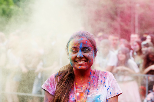 bright portrait of a young girl on the Holi festival of colors