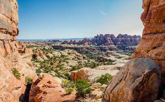 On a hot day, the sun roars over the rock formations in Utah's wilderness