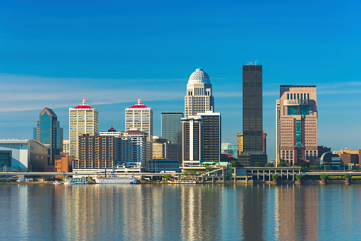 Downtown Louisville skyline with reflections on the Ohio River.