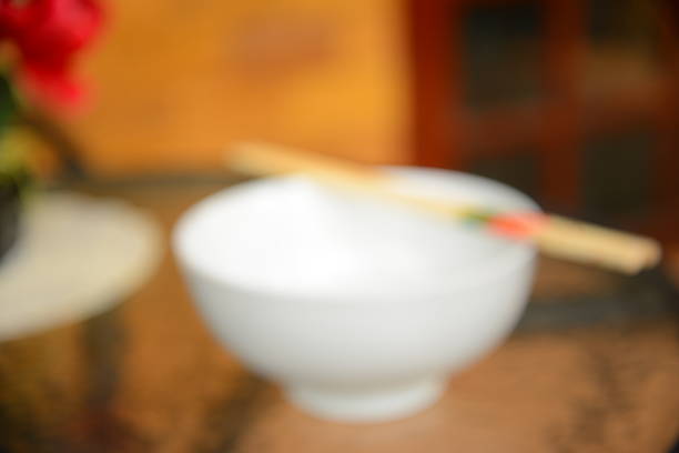Blurred Background: White Bowl with Chopsticks