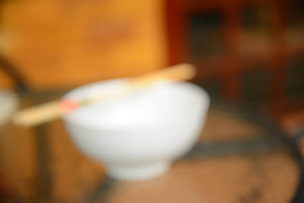 Blurred Background: White Bowl with Chopsticks