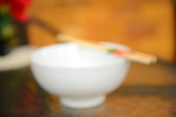 Blurred Background: White Bowl with Chopsticks