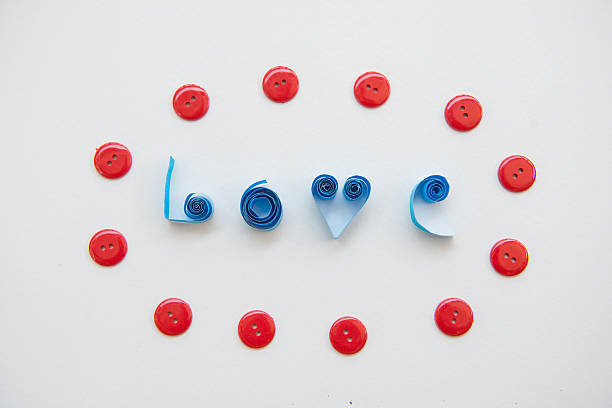 istock LOVE text from blue paper with red clasper 538178697