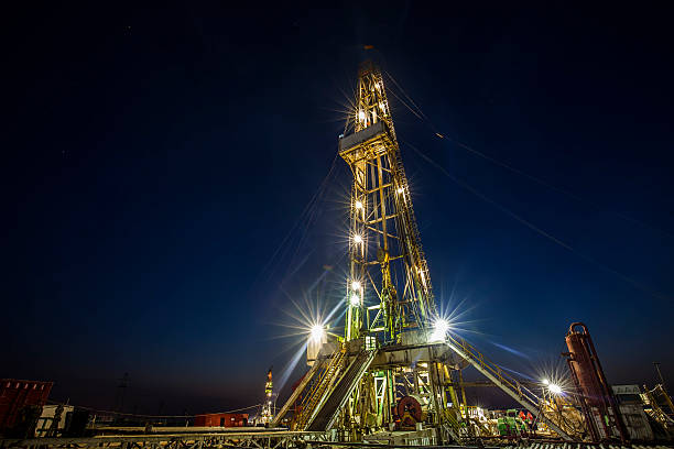 istock oilfield derrick at night 538178756