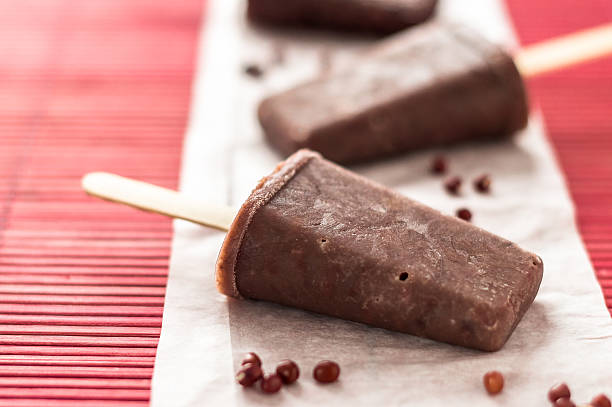 Red azuki beans ice pops The perfect sweet treat to cool off during hot summer days, this homemade popsicle is made with asian adzuki red beans ice cream. The frosted beans add texture to the ice pops and also boost the nutritional value, making it an healthier dessert choice for kids red bean dessert stock pictures, royalty-free photos & images