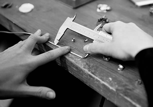 istock Female hands working on a jewellery design 538181353