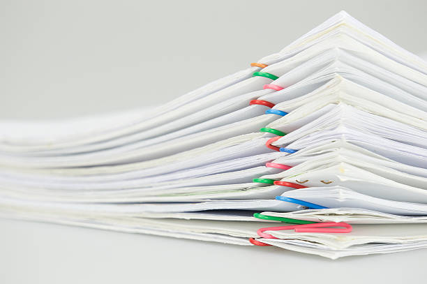istock Pile overload document of report on white background 538181894