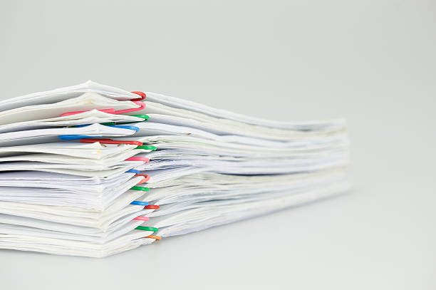 istock Pile overload paperwork of report on white background 538181966